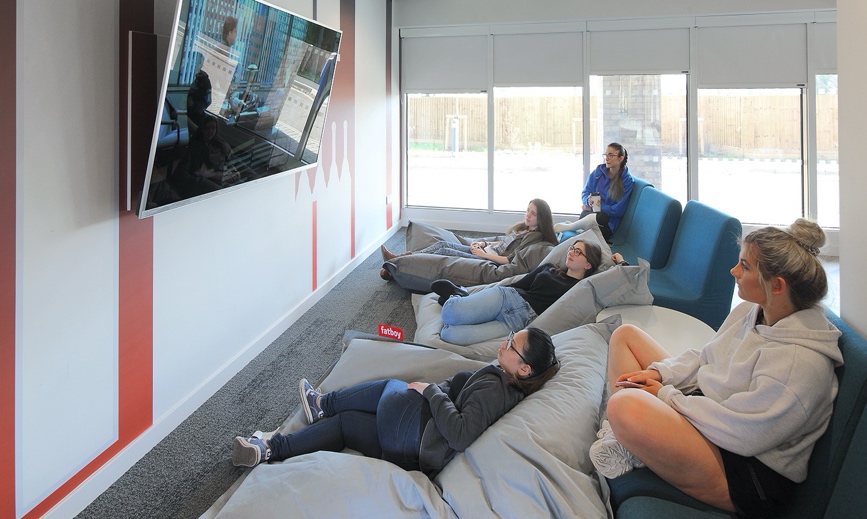 students watch tv in student accommodation winchester