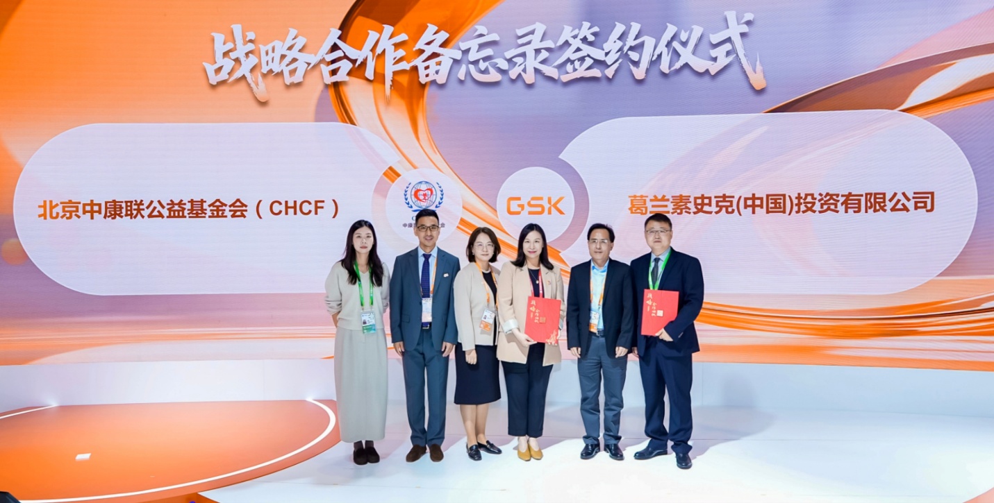 A group of people standing in front of a sign
AI-generated content may be incorrect.